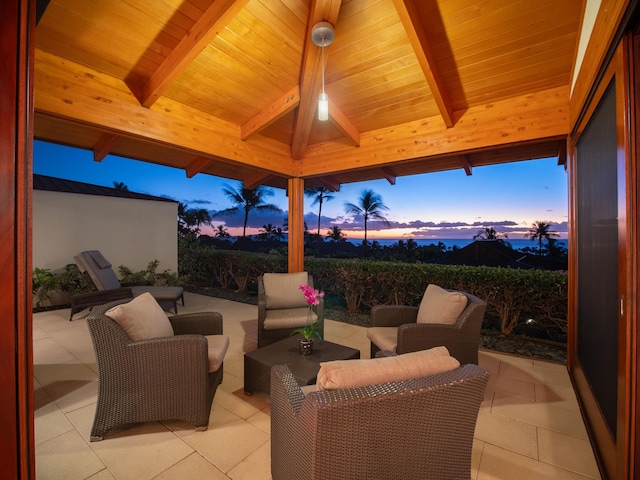 patio terrace at dusk with a gazebo and an outdoor hangout area