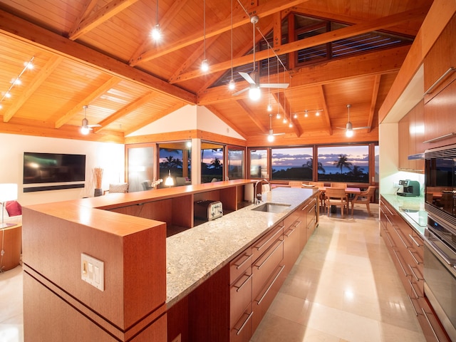 kitchen featuring pendant lighting, oven, wooden ceiling, and sink