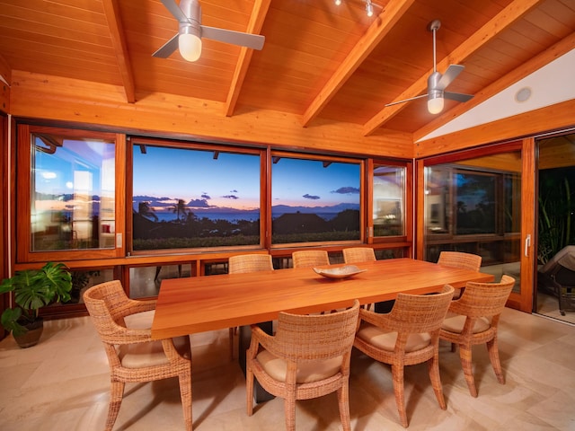 sunroom / solarium with lofted ceiling with beams, ceiling fan, and wooden ceiling