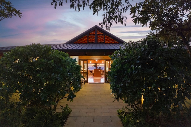 view of patio terrace at dusk