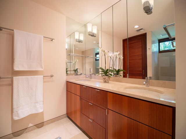 bathroom featuring tile patterned floors and vanity