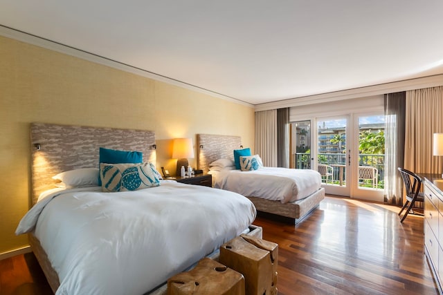 bedroom with dark hardwood / wood-style flooring, access to outside, and crown molding