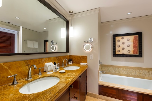 bathroom featuring tile patterned flooring, vanity, a tub to relax in, and crown molding