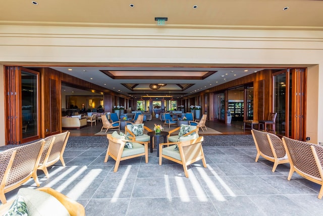 dining area featuring wood walls