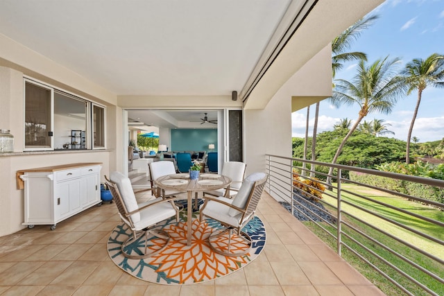 view of patio / terrace featuring ceiling fan and a balcony