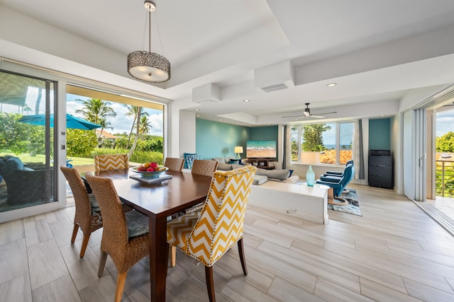 dining space featuring ceiling fan, light hardwood / wood-style floors, and a wealth of natural light