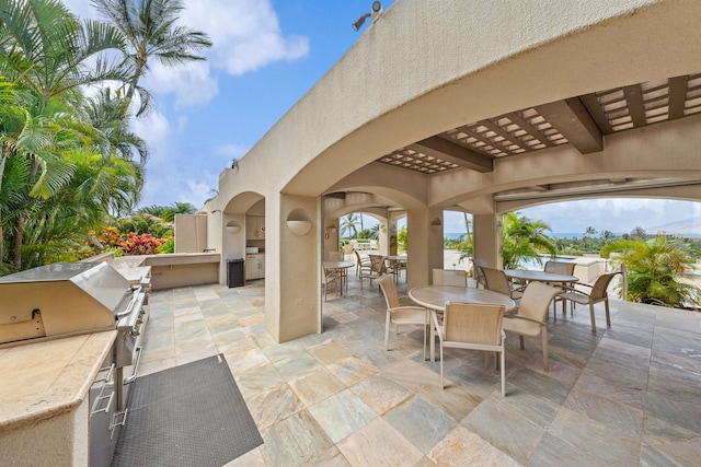 view of patio featuring area for grilling and exterior kitchen