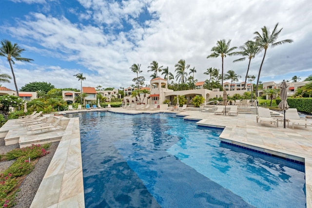 view of swimming pool with a patio