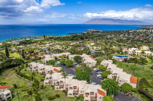 drone / aerial view with a water and mountain view