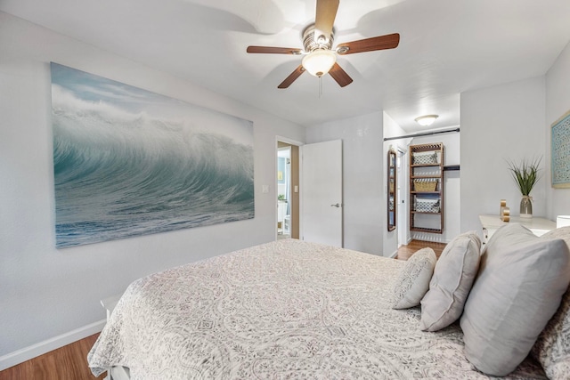 140 Uwapo Rd Unit 9-103, Kihei, HI 96753 - bedroom with wood finished floors, a closet, ceiling fan, and a walk in closet