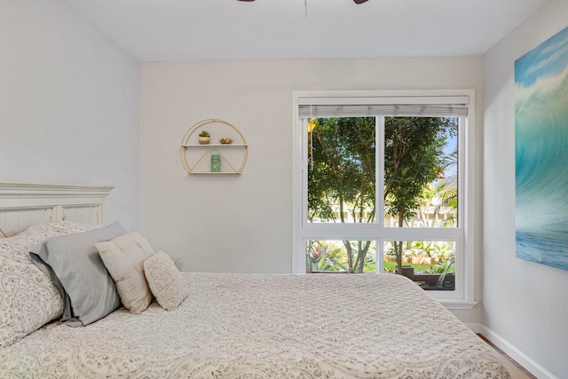 140 Uwapo Rd Unit 9-103, Kihei, HI 96753 - bedroom with wood finished floors and a ceiling fan