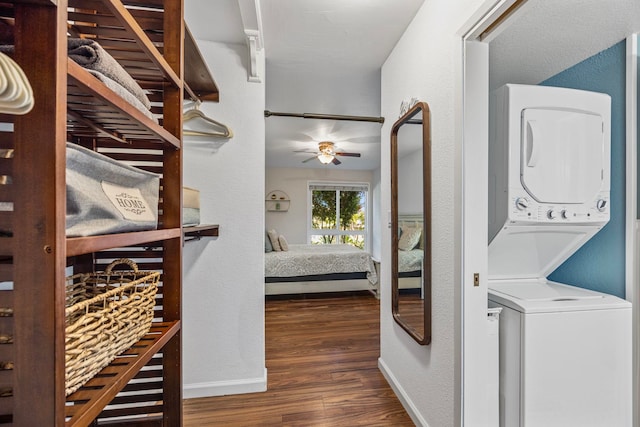 140 Uwapo Rd Unit 9-103, Kihei, HI 96753 - washroom featuring stacked washer / dryer, wood finished floors, and a ceiling fan