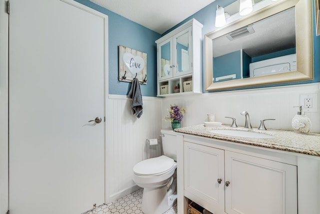 140 Uwapo Rd Unit 9-103, Kihei, HI 96753 - half bathroom featuring vanity and wainscoting