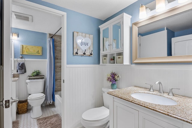 140 Uwapo Rd Unit 9-103, Kihei, HI 96753 - full bathroom featuring vanity, a wainscoted wall, shower / tub combo with curtain, and tile patterned flooring
