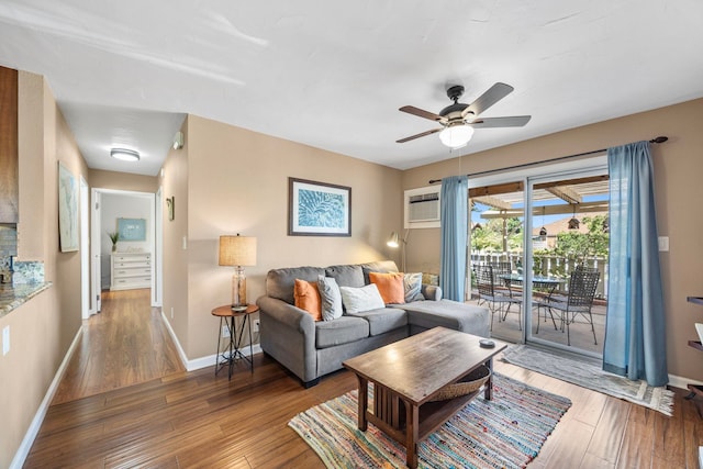 140 Uwapo Rd Unit 9-103, Kihei, HI 96753 - living area with a wall unit AC, ceiling fan, and hardwood / wood-style floors