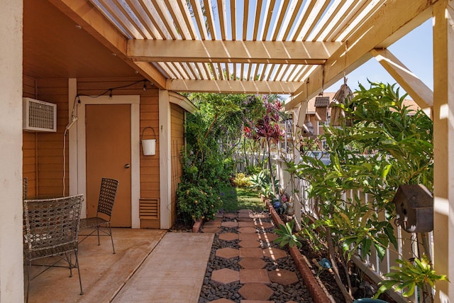 140 Uwapo Rd Unit 9-103, Kihei, HI 96753 - view of patio with a pergola and a wall mounted air conditioner