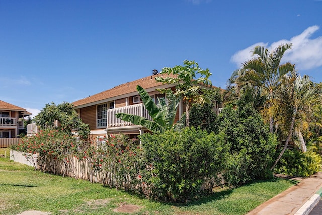140 Uwapo Rd Unit 9-103, Kihei, HI 96753 - view of side of home featuring a balcony and a yard