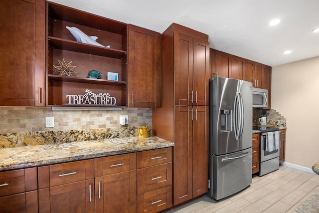 140 Uwapo Rd Unit 9-103, Kihei, HI 96753 - kitchen featuring stainless steel appliances, backsplash, light stone countertops, recessed lighting, and open shelves