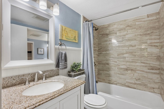 140 Uwapo Rd Unit 9-103, Kihei, HI 96753 - full bathroom featuring vanity, shower / tub combo, and a wainscoted wall