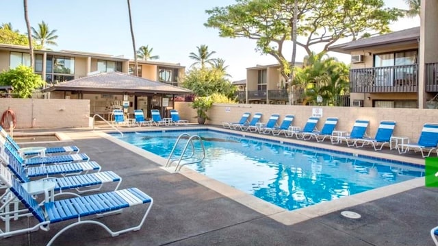 view of swimming pool featuring a patio area