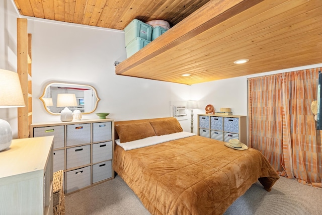 carpeted bedroom featuring an AC wall unit and wooden ceiling