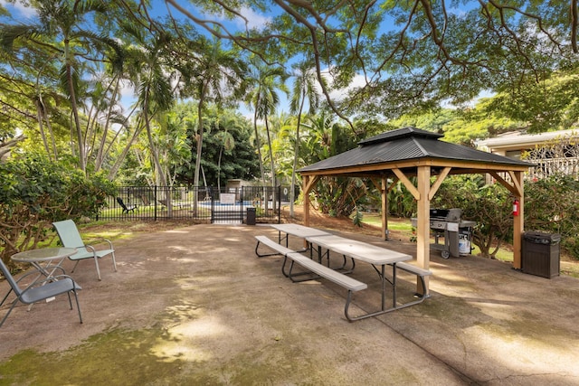 view of property's community with a gazebo and a patio area