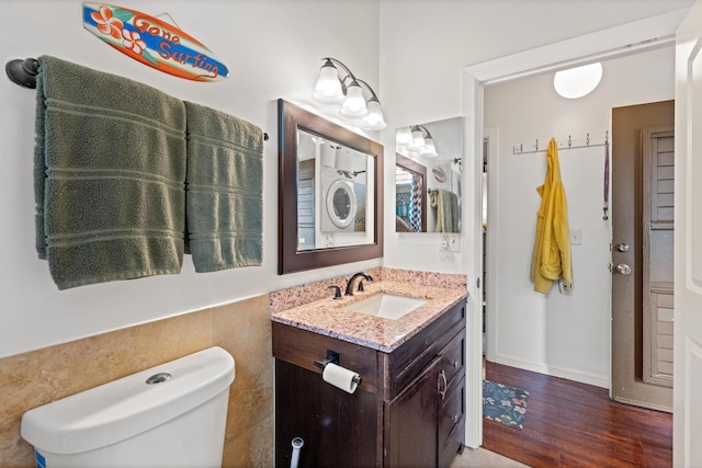 bathroom featuring vanity, hardwood / wood-style floors, and toilet