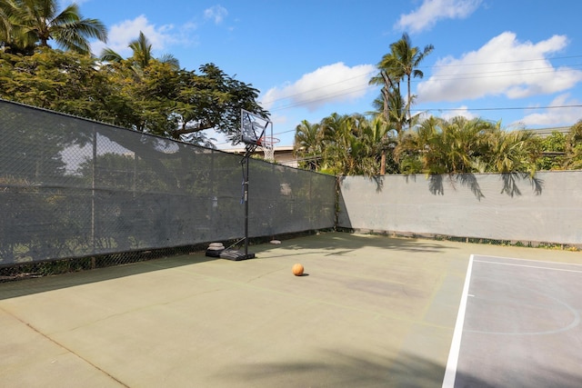 view of patio featuring basketball hoop