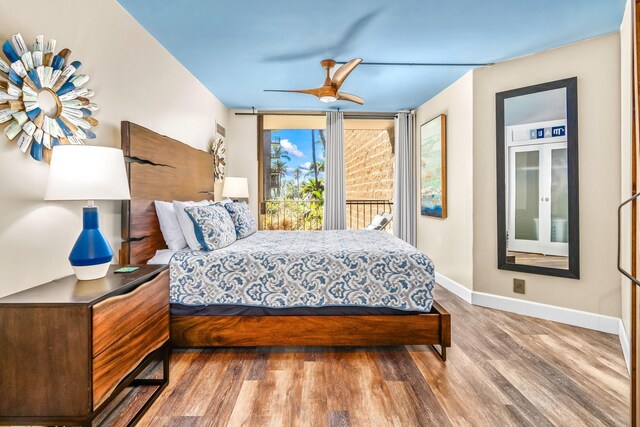 bedroom with ceiling fan, access to outside, and hardwood / wood-style flooring