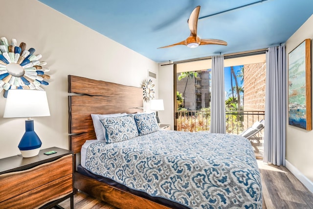 bedroom featuring a wall of windows, ceiling fan, access to outside, and wood-type flooring