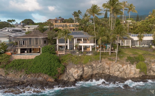 5163 Lower Honoapiilani Rd, Lahaina, HI 96761 - rear view of property featuring solar panels and a sunroom