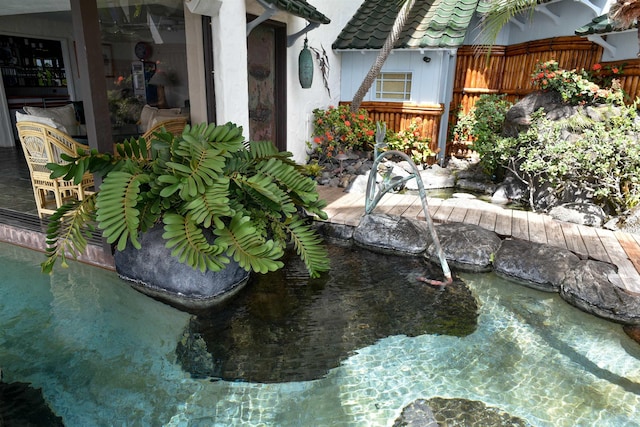 5163 Lower Honoapiilani Rd, Lahaina, HI 96761 - exterior view of fence and a garden pond