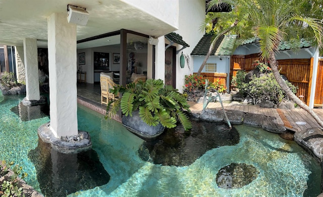 5163 Lower Honoapiilani Rd, Lahaina, HI 96761 - swimming pool featuring a small pond and fence