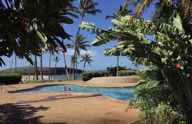 255 Kepuhi Pl Unit 13B04, Maunaloa, HI 96770 - community pool featuring a patio area