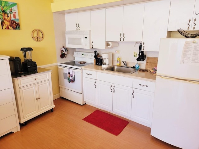 255 Kepuhi Pl Unit 13B04, Maunaloa, HI 96770 - kitchen with a sink, light wood-style flooring, white cabinets, and white appliances