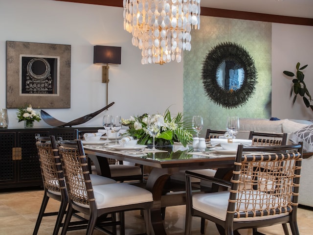 dining space featuring light tile patterned floors and a notable chandelier