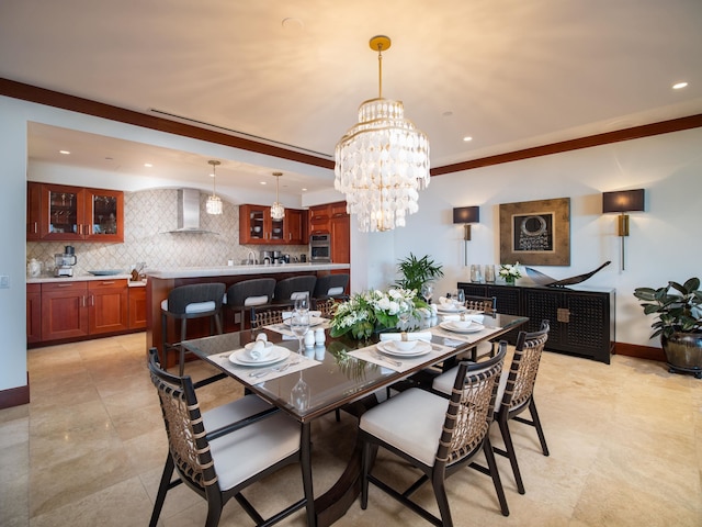 dining space featuring ornamental molding and a chandelier