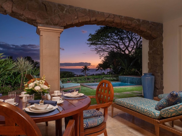 view of patio terrace at dusk