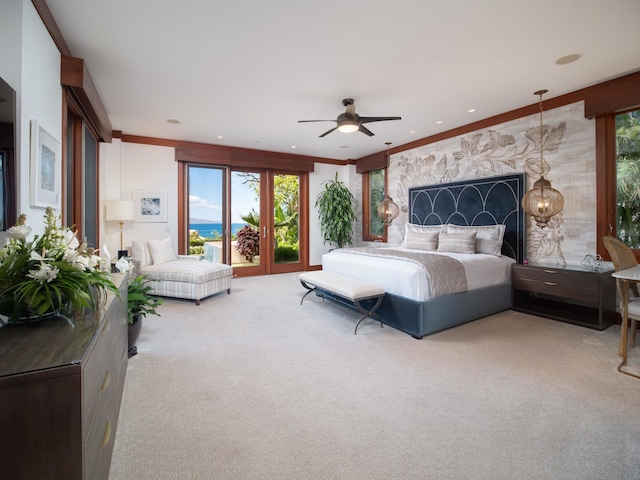 bedroom featuring ceiling fan, ornamental molding, and carpet floors