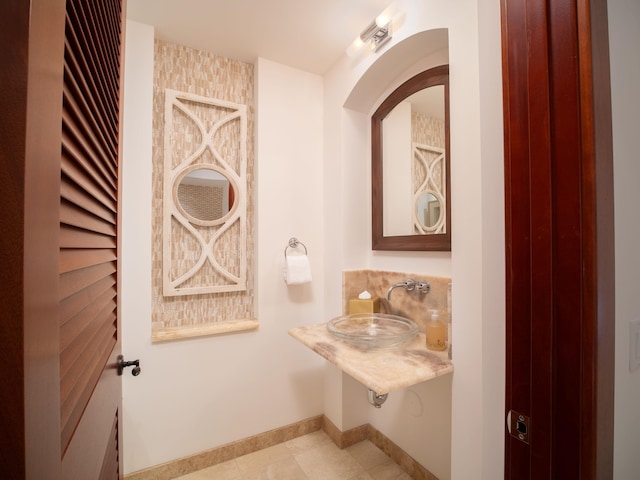 bathroom with tile patterned flooring and sink