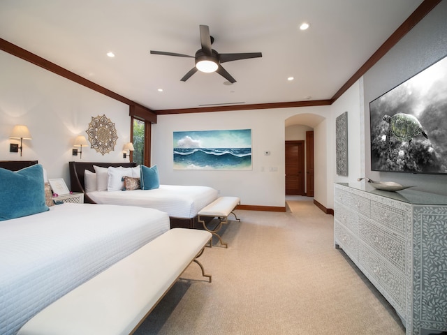 carpeted bedroom with crown molding and ceiling fan