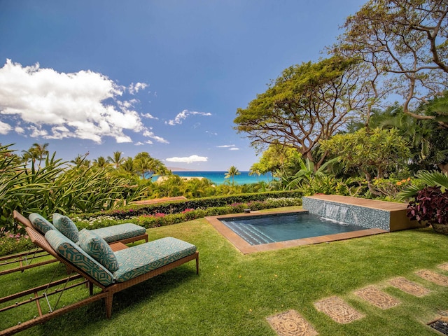 view of yard featuring a water view and pool water feature