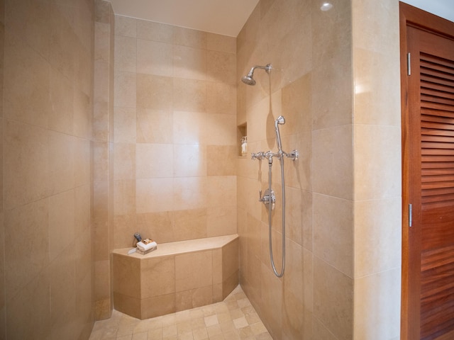 bathroom with tiled shower