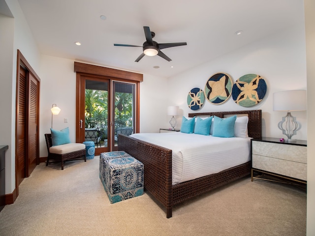 bedroom with light colored carpet, access to outside, ceiling fan, and a closet