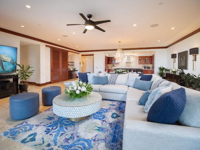 living room featuring ornamental molding and ceiling fan with notable chandelier