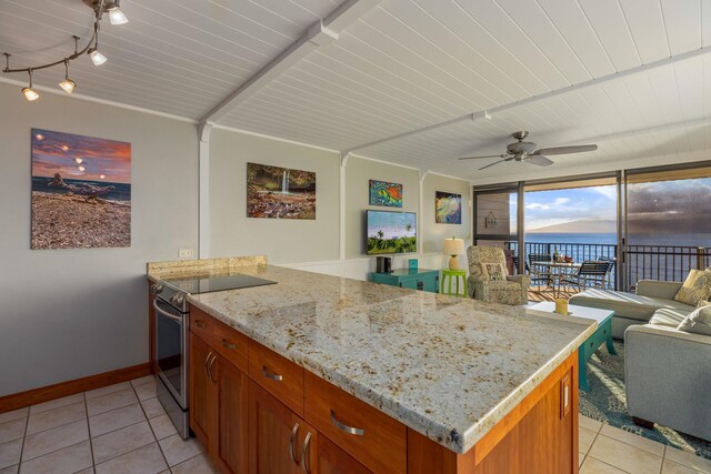 kitchen with ceiling fan, stainless steel range with electric cooktop, light stone counters, kitchen peninsula, and light tile patterned flooring