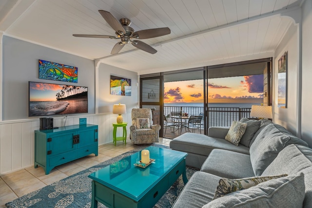 tiled living room with ceiling fan, a wall of windows, and wood ceiling