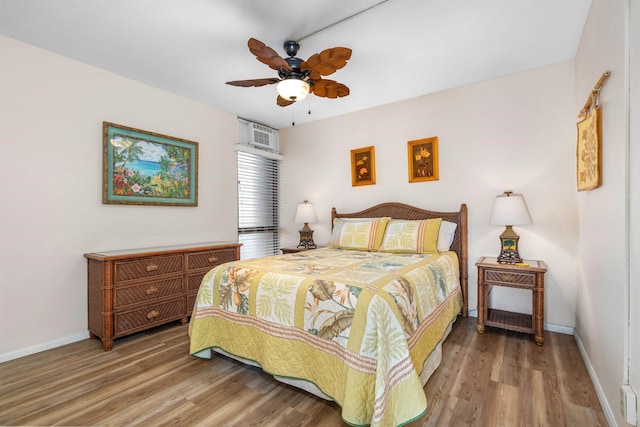 bedroom featuring ceiling fan and wood-type flooring