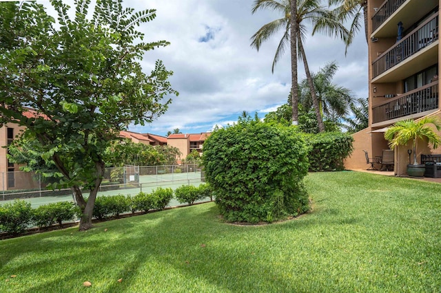 view of yard with a balcony