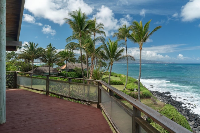 wooden deck featuring a water view